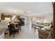 Open layout features a living room with a large sectional sofa and a dining area adjacent to the kitchen at 2613 Howland Blvd, Deltona, FL 32738