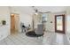 Cozy living area featuring tile floors, stylish chairs, and a large window at 2613 Howland Blvd, Deltona, FL 32738