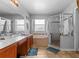 Bathroom featuring a vanity, tile floor, a soaking tub, and enclosed shower at 2837 Drifting Lilly Loop, Kissimmee, FL 34747