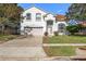 Charming two-story home with manicured lawn, a two-car garage, and lush landscaping at 2837 Drifting Lilly Loop, Kissimmee, FL 34747