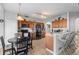 Spacious kitchen with modern appliances, wood cabinets, and a breakfast bar for casual dining at 2837 Drifting Lilly Loop, Kissimmee, FL 34747