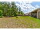 Large backyard with plenty of trees, backing to conservation area, offering privacy at 2951 E Waco Dr, Deltona, FL 32738
