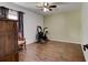 Bedroom featuring wood-look tile floors, a ceiling fan, and space for a workout area at 2951 E Waco Dr, Deltona, FL 32738