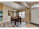Charming dining area with wood flooring and views into the laundry room at 2951 E Waco Dr, Deltona, FL 32738