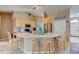 Bright, spacious kitchen with light wood cabinets, stainless steel appliances, and a large center island with seating at 2951 E Waco Dr, Deltona, FL 32738