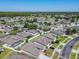 An aerial view of a residential neighborhood featuring manicured lawns, mature trees, and lovely single-Gathering homes at 2977 White Cedar Cir, Kissimmee, FL 34741