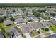 Aerial view displays homes with fenced yards and lush landscaping at 2977 White Cedar Cir, Kissimmee, FL 34741