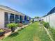 Spacious backyard with a screened lanai, patio and tropical landscaping at 2977 White Cedar Cir, Kissimmee, FL 34741