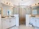 Bathroom featuring dual sinks, glass shower and tile flooring at 2977 White Cedar Cir, Kissimmee, FL 34741