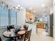 Kitchen eat-in featuring decorative lighting and view to updated kitchen at 2977 White Cedar Cir, Kissimmee, FL 34741