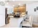 Bright kitchen with a breakfast bar and modern stainless steel appliances at 2977 White Cedar Cir, Kissimmee, FL 34741