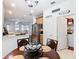 Kitchen eat-in featuring stainless steel refrigerator and decorative overhead lighting at 2977 White Cedar Cir, Kissimmee, FL 34741