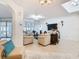 Bright and airy living room with neutral colors, tile flooring, and plenty of natural light at 2977 White Cedar Cir, Kissimmee, FL 34741
