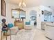 Bright and airy living room with neutral colors, tile flooring, and decorative furniture at 2977 White Cedar Cir, Kissimmee, FL 34741