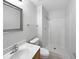 Compact bathroom with a stand-up shower, white fixtures, and a clean, modern design at 3115 Whispering Trails St, Winter Haven, FL 33884