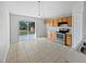 Bright kitchen with sliding door access to the backyard, stainless steel appliances, and tile floors at 3115 Whispering Trails St, Winter Haven, FL 33884