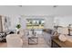 Bright living room with contemporary decor, large sliding glass doors, and stylish furnishings providing a comfortable retreat at 3499 Douglas Fir Dr, Apopka, FL 32703