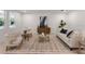 Bright living room with contemporary decor, including neutral-toned furniture, a stylish rug, and ample natural light at 3532 Douglas Fir Dr, Apopka, FL 32703