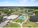 An aerial view of the community with golf course, lakes, community pool and club house at 3660 Ventura Club Cir, Orlando, FL 32822