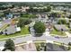 Aerial view of a home in a neighborhood with mature trees and well-kept lawns at 3660 Ventura Club Cir, Orlando, FL 32822