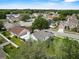 Aerial view of a home with a screened-in patio and mature trees at 3660 Ventura Club Cir, Orlando, FL 32822