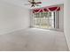 Spacious bedroom featuring neutral walls, carpet, and a bright window at 3660 Ventura Club Cir, Orlando, FL 32822