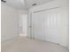 Bedroom with carpet, neutral walls, and a double closet at 3660 Ventura Club Cir, Orlando, FL 32822