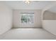 A bright bedroom with a ceiling fan and a large window offering ample natural light at 3660 Ventura Club Cir, Orlando, FL 32822