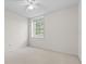 Neutral bedroom featuring carpeted floors and a window offering natural light at 3660 Ventura Club Cir, Orlando, FL 32822