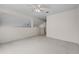 An empty bedroom featuring neutral walls, carpet, and a pass-through at 3660 Ventura Club Cir, Orlando, FL 32822