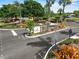 Club house entrance with manicured landscaping and convenient parking at 3660 Ventura Club Cir, Orlando, FL 32822