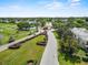 Scenic community entrance with lush landscaping, a gate, and access to golf course and amenities at 3660 Ventura Club Cir, Orlando, FL 32822