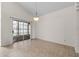 Dining room with sliding glass doors for outdoor access and modern lighting at 3660 Ventura Club Cir, Orlando, FL 32822