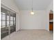 Dining room with sliding glass doors for outdoor access and modern lighting at 3660 Ventura Club Cir, Orlando, FL 32822