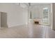Spacious living room features a fireplace, tall windows, and tile flooring at 3660 Ventura Club Cir, Orlando, FL 32822