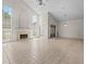 Spacious living room features a fireplace, tall windows, and tile flooring at 3660 Ventura Club Cir, Orlando, FL 32822