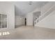 Open concept living room with tile floors, high ceilings and a staircase at 3660 Ventura Club Cir, Orlando, FL 32822