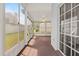 Carpeted sunroom/patio surrounded by multiple screened windows at 3660 Ventura Club Cir, Orlando, FL 32822