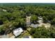 Aerial view of the neighborhood with mature trees and well-spaced homes at 441 S Blue Lake Ave, Deland, FL 32724