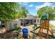 The backyard offers a shed, play area, and a screened-in porch for outdoor enjoyment and relaxation at 441 S Blue Lake Ave, Deland, FL 32724
