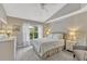 Neutral bedroom featuring a bed, dresser, carpet, ceiling fan and natural light at 441 S Blue Lake Ave, Deland, FL 32724