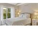 Bedroom featuring a bed, dresser, carpet, ceiling fan, and natural light at 441 S Blue Lake Ave, Deland, FL 32724