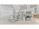 Spacious kitchen with stainless steel appliances, white cabinetry, and an open layout, great for entertaining guests at 441 S Blue Lake Ave, Deland, FL 32724