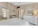 Bedroom with carpet, ceiling fan, two closets, a ceiling fan, and an adjacent bonus room at 441 S Blue Lake Ave, Deland, FL 32724