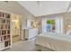 Main bedroom with walk-out access, carpet, light walls, and a view of the bathroom at 441 S Blue Lake Ave, Deland, FL 32724