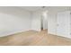 Vacant bedroom featuring light wood flooring and a doorway to a walk-in closet at 443 Marion Oaks Crse, Ocala, FL 34473