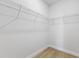 Spacious walk-in closet with white wire shelving for optimal organization at 443 Marion Oaks Crse, Ocala, FL 34473