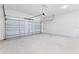 Spacious garage with concrete flooring and an automatic door at 443 Marion Oaks Crse, Ocala, FL 34473