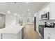 A bright kitchen showcases modern stainless steel appliances, white cabinets, and countertop at 443 Marion Oaks Crse, Ocala, FL 34473