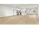 Bright, open-concept living space featuring neutral walls and modern laminate flooring at 443 Marion Oaks Crse, Ocala, FL 34473
